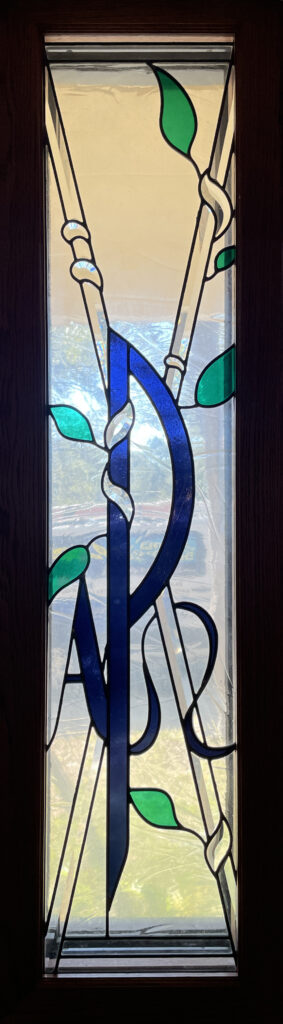 letters  A and P in stained glass.