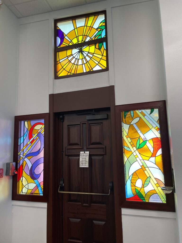 image of two new panels and the pre existing panel above the door. 