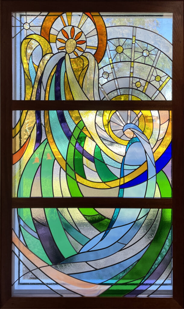 stained glass window of abstract angel and mary