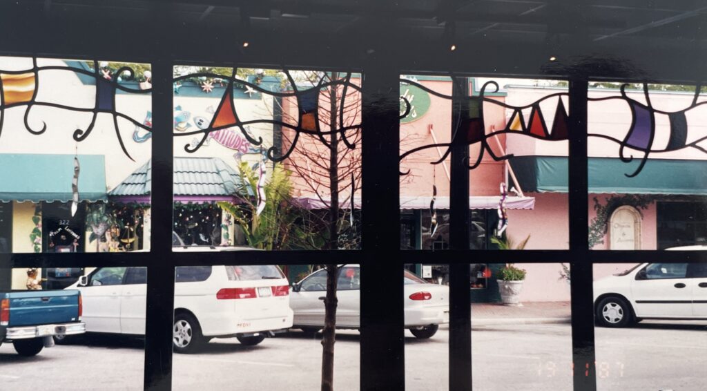 transom window with abstract metal and glass designs. 