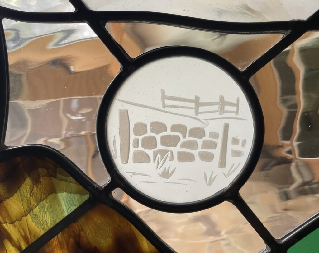 up close detail of etched glass stone wall. 